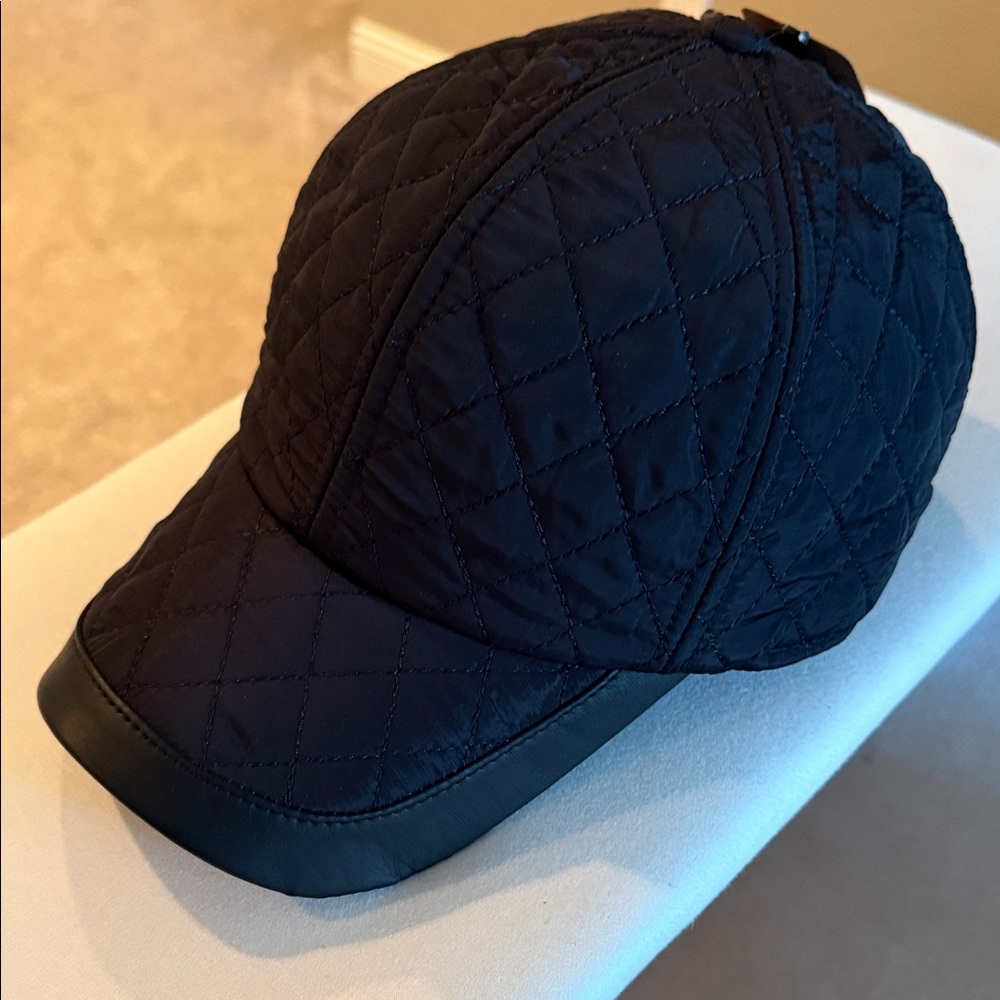 New w tags GO & Go original quilted hat w ear flaps. 
Adjustable strap for fit